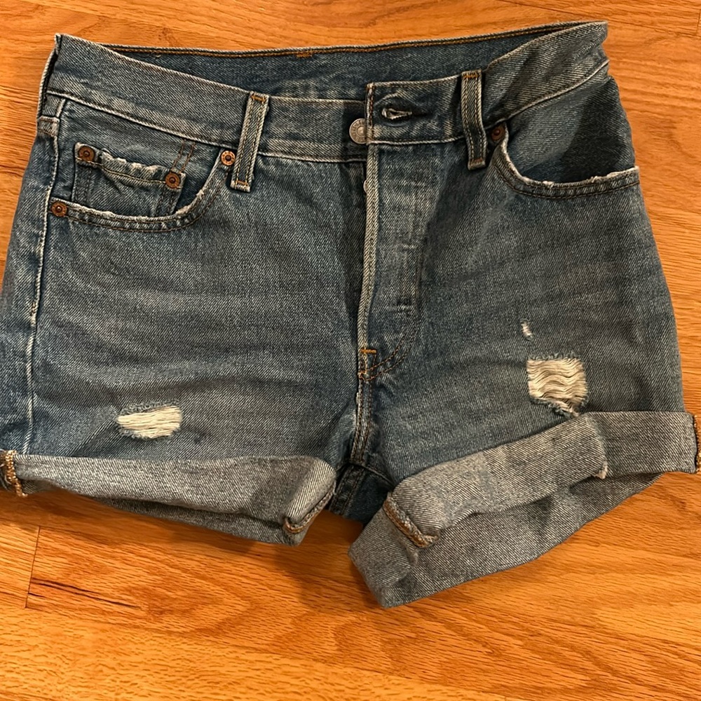 Distressed Levi 501 denim shorts.